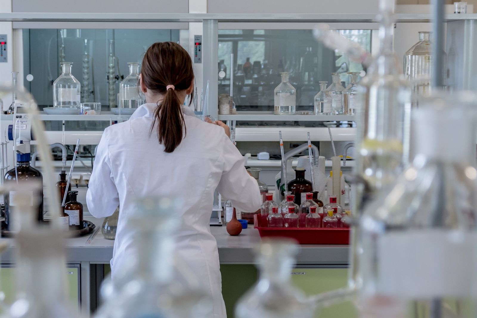 Woman in lab coat working in laboratory